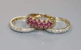 A modern 9ct gold, ruby and diamond triple ring set, size N.