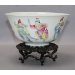 A Chinese famille rose bowl, Qianlong mark but early 20th century diameter 17.5cm, wood stand