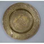 A 19th century Persian hand embossed brass dish