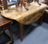 A late George III mahogany oval topped drop leaf dining table W.149cm