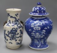 A large 19th century Chinese blue and white vase and cover and a crackle glaze dragon vase tallest