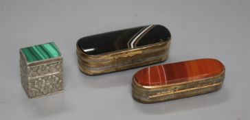 A sterling silver and malachite pill box and two 19th century gilt metal and agate boxes.