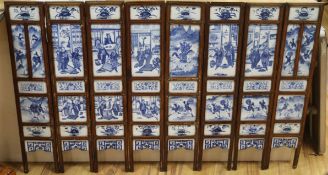 A 19th century Chinese blue and white porcelain panelled screen length 136cm