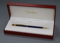 A Must de Cartier 'Trinity' blue and gold-coloured ballpoint pen, boxed