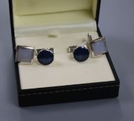 A pair of Dunhill silver and blue enamel 'Headlamp' cufflinks and a pair of silver and mother of