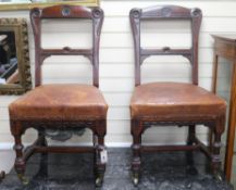 A pair of oak gothic side chairs by Holland & Sons, similar to the plain 'standard' pattern designed