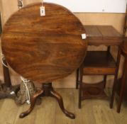 A George III mahogany circular tilt top tea table and a George III mahogany two tier washstand (2)