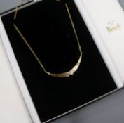 An 18ct three-colour gold pendant necklace incorporating two diamond-set crescents, approx. 40cm.