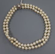 A double strand cultured pearl necklace, with diamond and gem set circular clasp, 42cm.