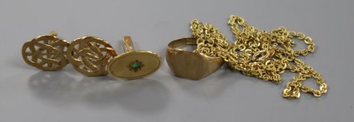 A 9ct yellow gold signet ring, a 9ct gold and emerald cufflink, a pair of yellow metal cufflinks and