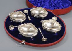 A cased set of four late Victorian silver salts and matching spoons, William Hutton & Sons,