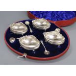 A cased set of four late Victorian silver salts and matching spoons, William Hutton & Sons,