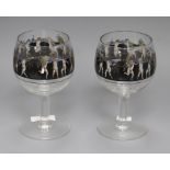 A pair of Vetri Della Arte goblets, enamelled with a frieze of putti height 19.5cm
