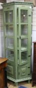 A green and floral painted pentagonal display cabinet W.86cm