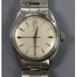 A gentleman's stainless steel Tudor Oyster manual wind wrist watch, on a stainless steel Rolex