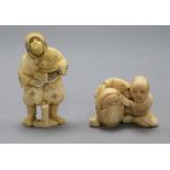 Two early 20th century Japanese ivory netsuke of a peasant woman with swivelling face and a doll