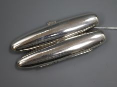 An Austro-Hungarian 900 standard white metal twin compartment cigar case, 11.8cm.