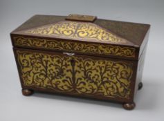 A Regency rosewood two-division tea caddy, of sarcophagus form inlaid with cut brasswork (two