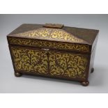 A Regency rosewood two-division tea caddy, of sarcophagus form inlaid with cut brasswork (two