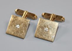 A pair of 9ct yellow gold square cufflinks, each set with a small diamond, gross 10.4 grams.