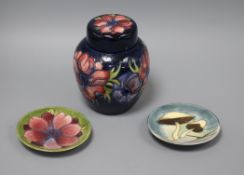 A Moorcroft Anemone pattern ginger jar and cover and two pin dishes, one in the Toadstool design,