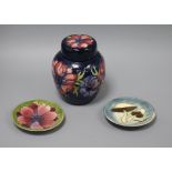 A Moorcroft Anemone pattern ginger jar and cover and two pin dishes, one in the Toadstool design,