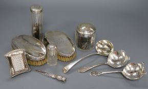 Mixed silver including mounted bottles, brushes, ladle, small frame and bookmark.