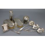 Mixed silver including mounted bottles, brushes, ladle, small frame and bookmark.