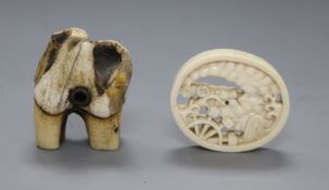 A 19th century Japanese ivory oval manju netsuke and a stag antler root netsuke,