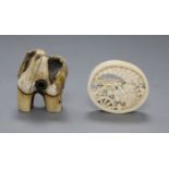 A 19th century Japanese ivory oval manju netsuke and a stag antler root netsuke,