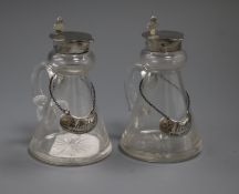 A pair of George V silver mounted glass spirit jugs and silver wine labels, John Grinsell & Sons,