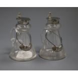 A pair of George V silver mounted glass spirit jugs and silver wine labels, John Grinsell & Sons,