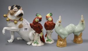 A Meissen style model of a pug and a pair of Chinese porcelain cockerels and a pair of porcelain