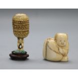 A late 19th century Japanese walrus ivory netsuke of a boy and sack and an ivory netsuke of a man