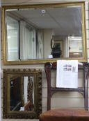 A carved giltwood picture framed wall mirror and a rectangular beaded gilt framed wall mirror W.88
