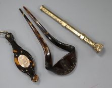An early 20th century yellow metal overlaid propelling pen and two tortoiseshell items including a
