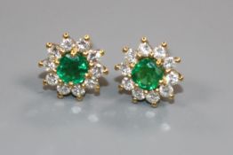 A pair of 18ct yellow gold, emerald and diamond flowerhead stud earrings, 9mm.