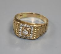 A gentlemen's 14ct yellow gold and diamond ring, the central diamond in square setting surrounded by