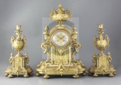 A third quarter of the 19th century French ormolu clock garniture, the architectural break arch case