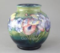 A Moorcroft Spring Flowers pattern globular vase, post war height 8in.