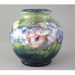 A Moorcroft Spring Flowers pattern globular vase, post war height 8in.