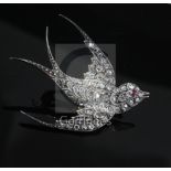 A late Victorian gold, silver and rose cut diamond set swallow brooch, with ruby set eye, length