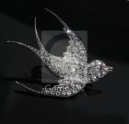 A late Victorian gold, silver and rose cut diamond set swallow brooch, with ruby set eye, length