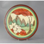 A Clarice Cliff Limberlost pattern circular wall plaque, c.1931, the border banded in matching