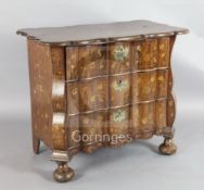 An early 19th century Dutch walnut and marquetry serpentine chest, inlaid with flowers in an urn and