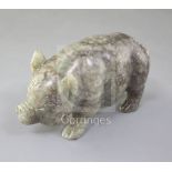 A Chinese celadon and brown jade figure of a pig, standing on all fours, length 10.7cm