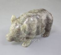 A Chinese celadon and brown jade figure of a pig, standing on all fours, length 10.7cm