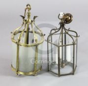 A small brass framed hanging lantern and a black painted iron hexagonal lantern