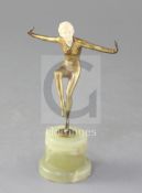 R. Loz. An Art Deco ivory and bronze figure of a dancer, raised on a green onyx pedestal base,