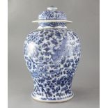 A Chinese blue and white baluster vase, Kangxi period, painted with phoenixes amid peonies and